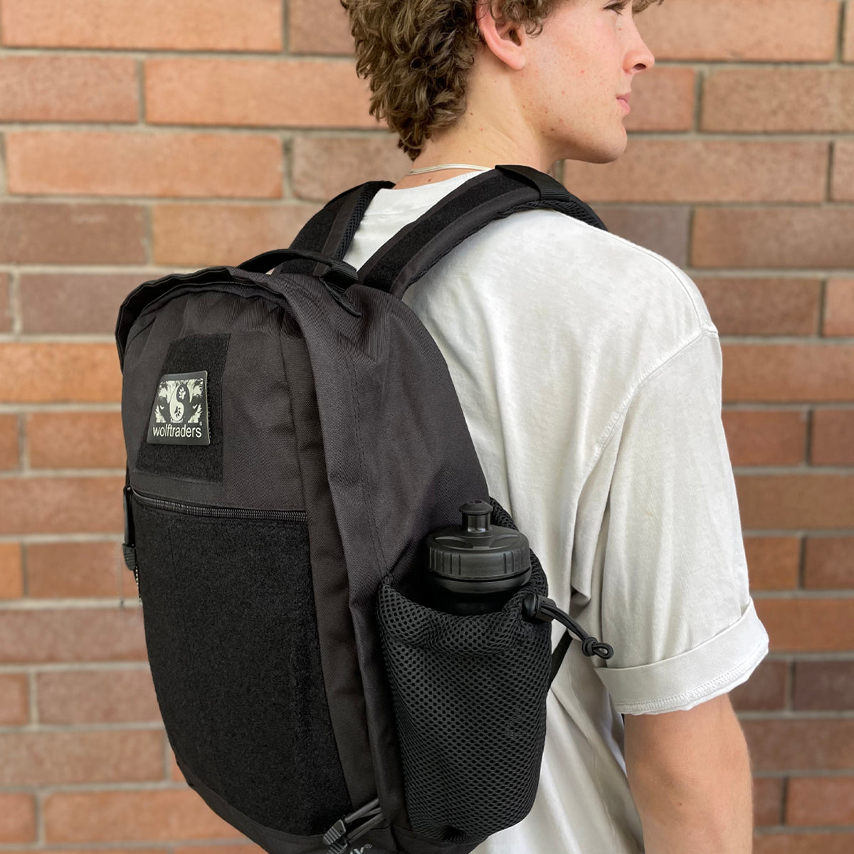 Wolftraders CasualWolf 20-Liter Tactical Day Backpack on back