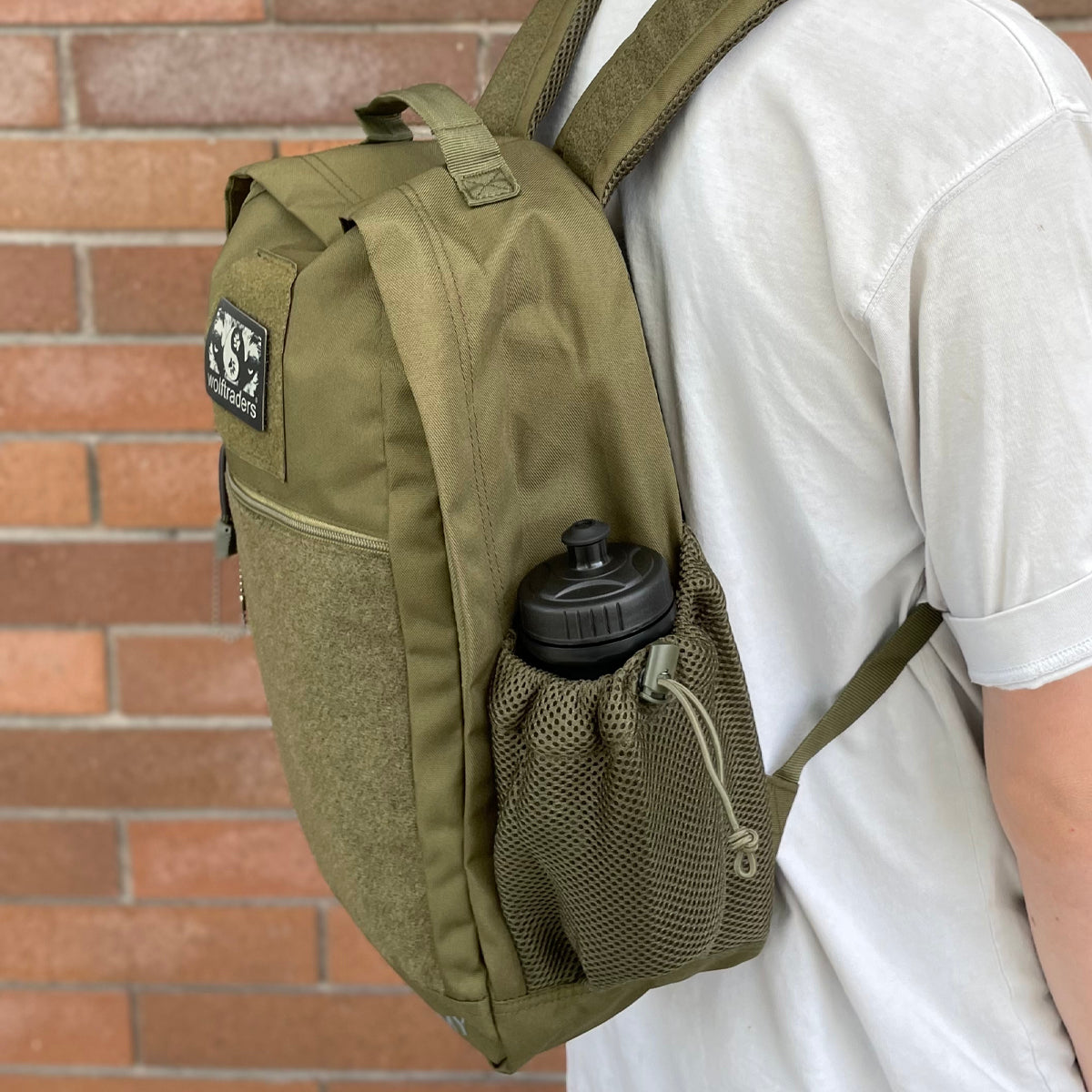 Wolftraders CasualWolf 20-Liter Tactical Day Backpack OD Green Bottle side on back