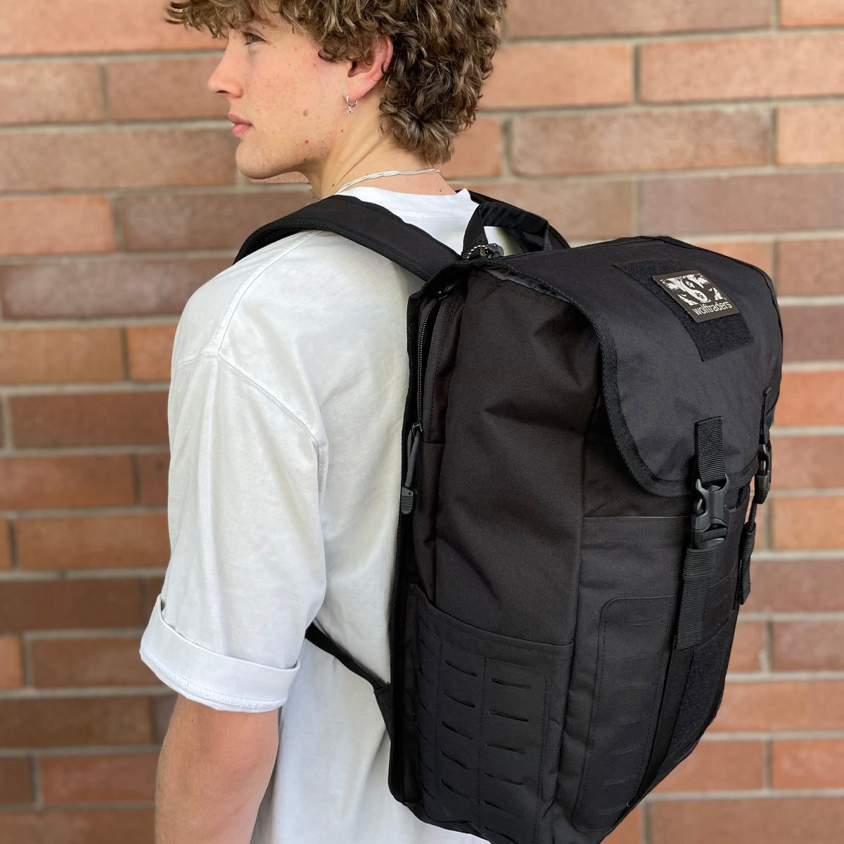 Wolftraders LoadedWolf multiOperational 40 Liter Tactical Backpack Black Side 2 on model