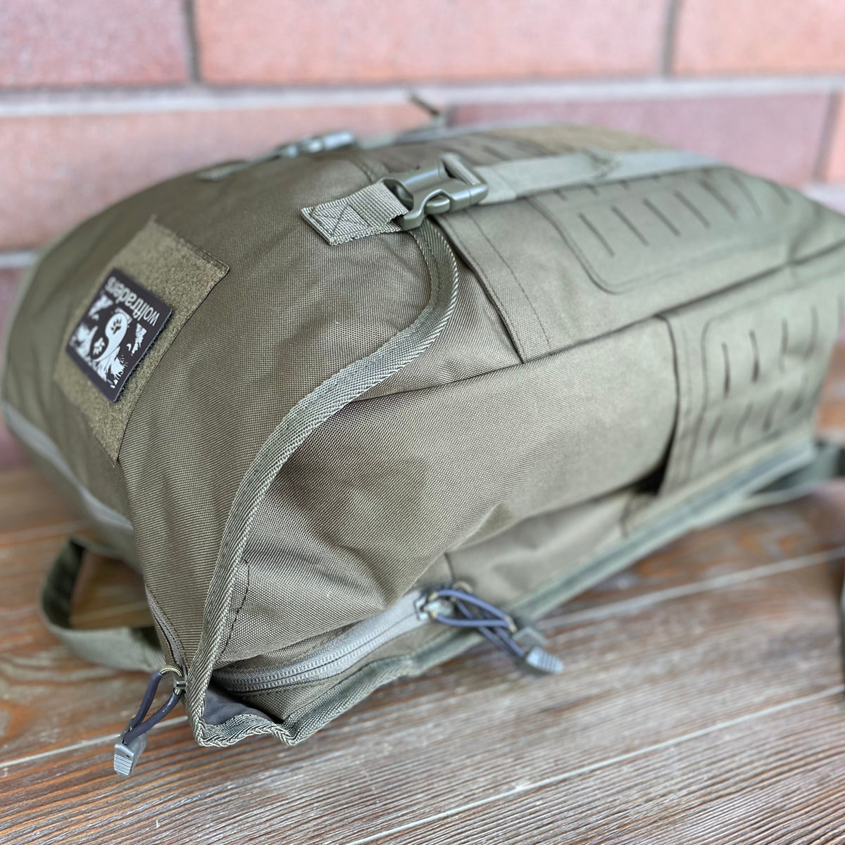 Wolftraders LoadedWolf multiOperational 40 Liter Tactical Backpack Olive Draft Green Lying down